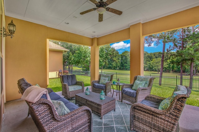 view of patio / terrace with an outdoor living space and ceiling fan