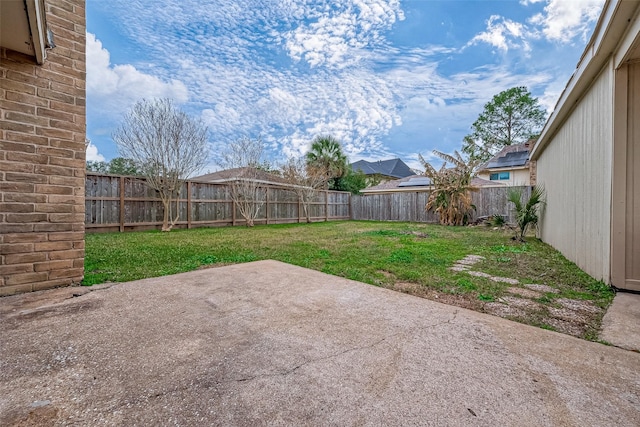 view of yard with a patio and a fenced backyard