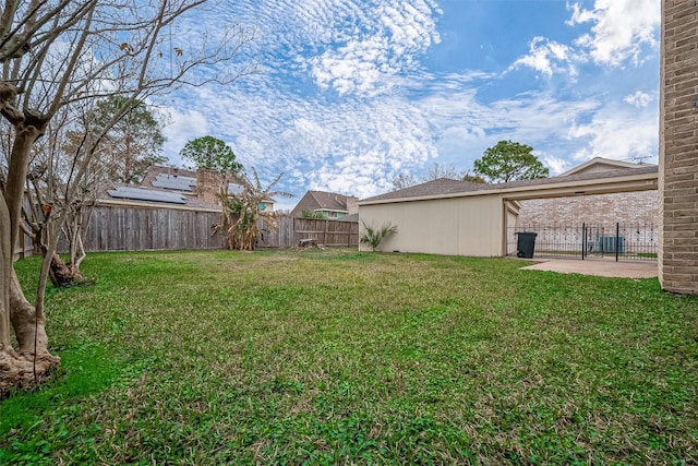 view of yard featuring a patio and a fenced backyard