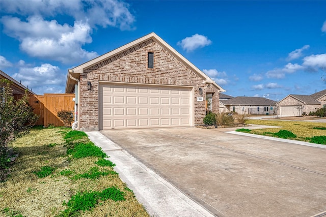 view of front facade featuring a garage and a front lawn