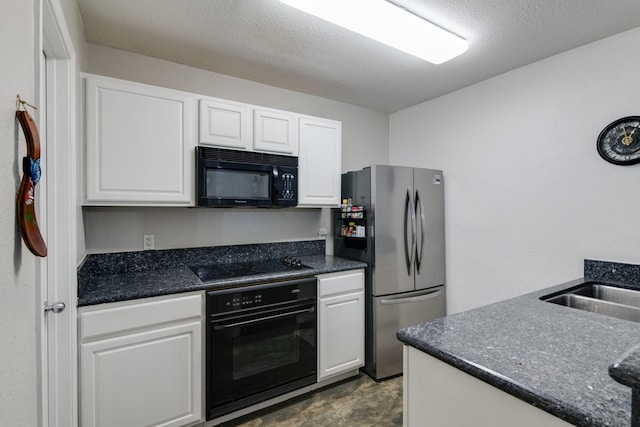 kitchen with white cabinetry, a textured ceiling, and black appliances