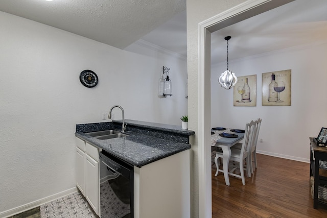 kitchen with sink, dishwasher, hanging light fixtures, dark hardwood / wood-style floors, and white cabinets