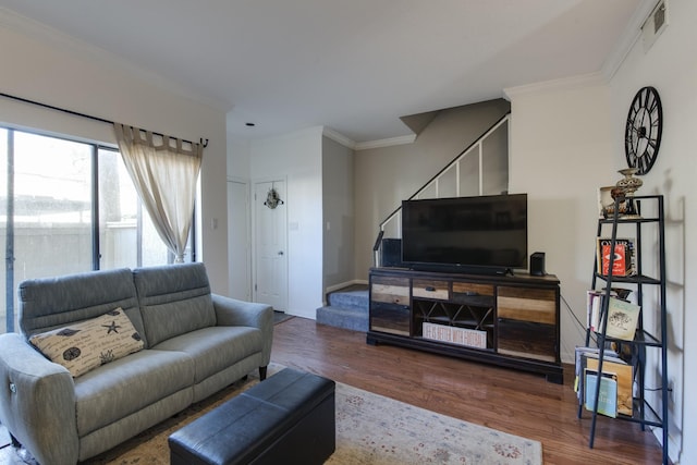 living room featuring hardwood / wood-style floors and ornamental molding