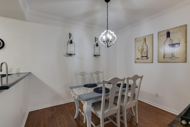 dining room with ornamental molding and dark hardwood / wood-style floors