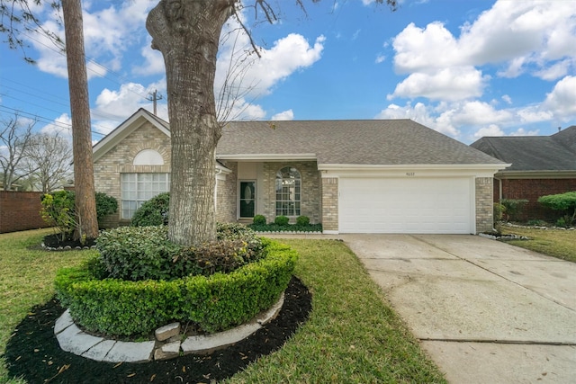 single story home with a garage and a front lawn