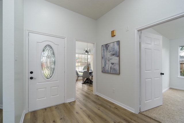 foyer entrance with light hardwood / wood-style floors