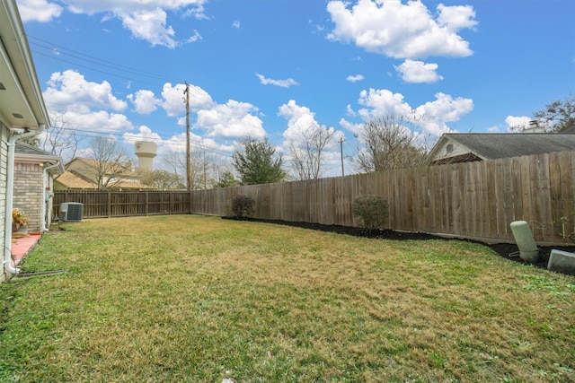 view of yard with central AC