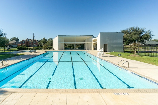 view of swimming pool with a patio area