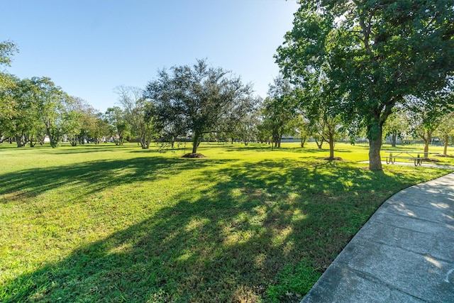 view of property's community with a lawn