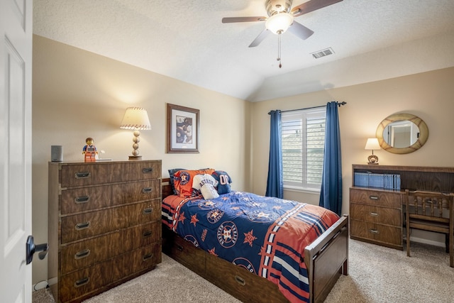 19106 High Canyon Ln, Tomball, TX 77377 - bedroom with carpet floors, vaulted ceiling, ceiling fan, and a textured ceiling