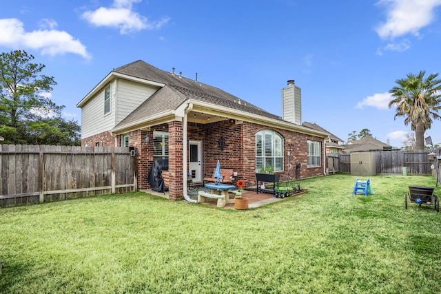 19106 High Canyon Ln, Tomball, TX 77377 - back of house with brick siding, a chimney, a patio area, and roof with shingles