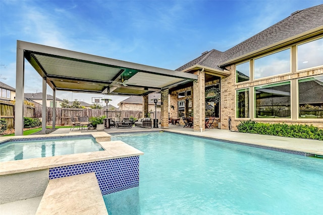 view of swimming pool with a patio and a jacuzzi