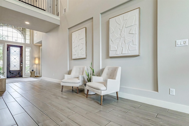 foyer featuring a towering ceiling