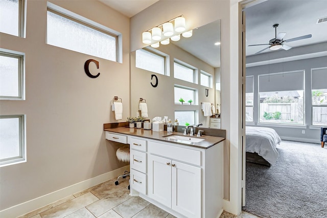 bathroom featuring vanity, tile patterned flooring, a wealth of natural light, and ceiling fan