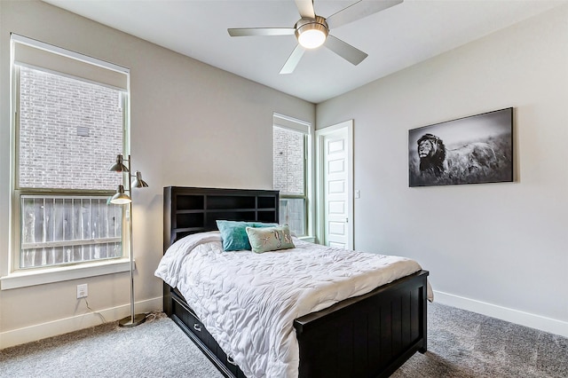 bedroom with dark carpet and ceiling fan