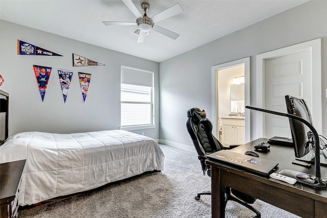 bedroom with ceiling fan, carpet, and ensuite bath