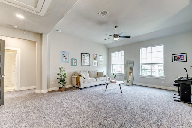 living room featuring light colored carpet and ceiling fan