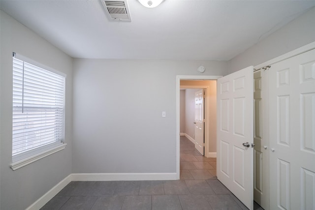 view of tiled spare room