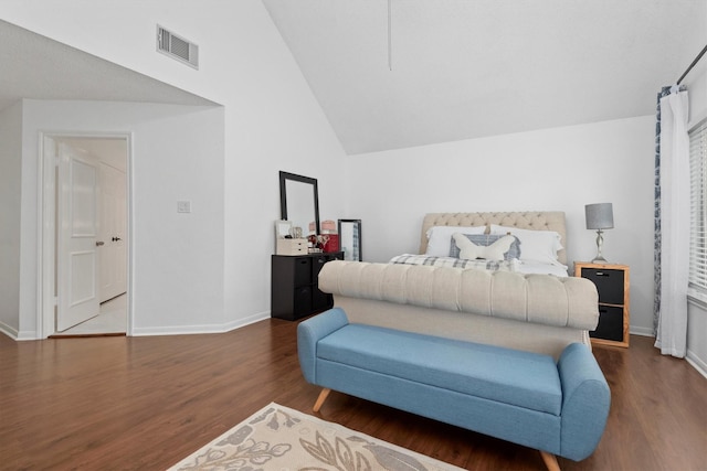 bedroom with high vaulted ceiling and dark hardwood / wood-style flooring