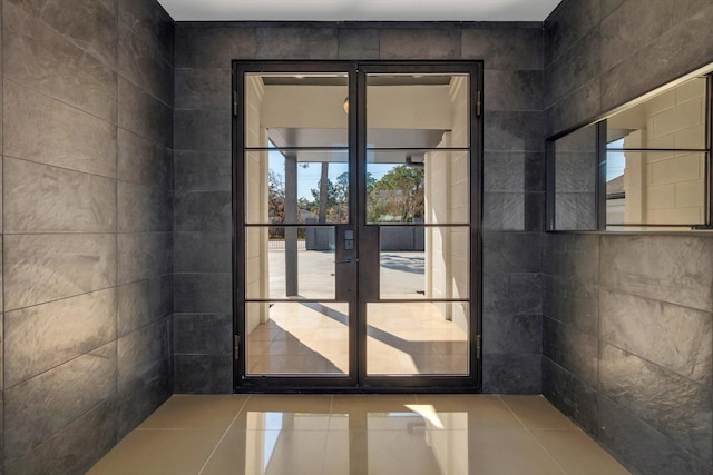 doorway featuring french doors and tile patterned flooring