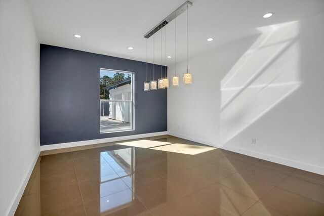 spare room with tile patterned flooring