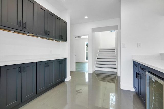 kitchen with light tile patterned floors and wine cooler