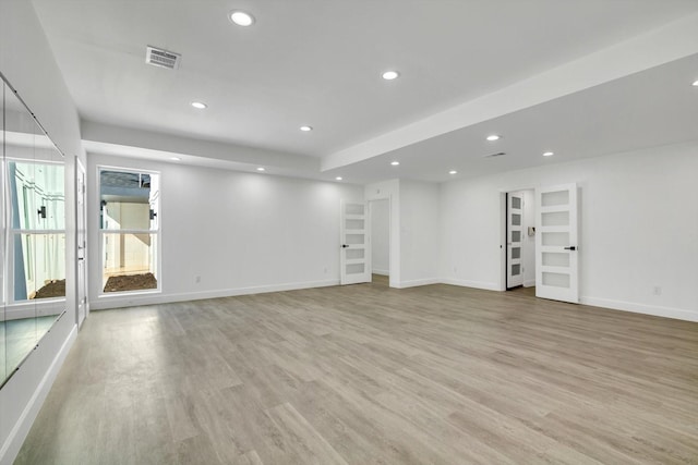 unfurnished living room featuring light hardwood / wood-style floors