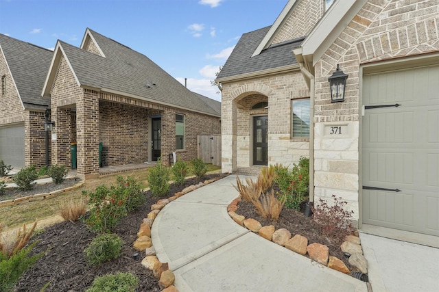 doorway to property featuring a garage