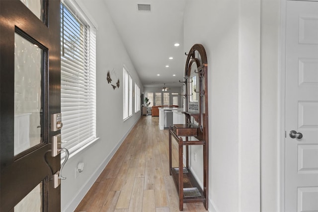 corridor featuring light hardwood / wood-style floors