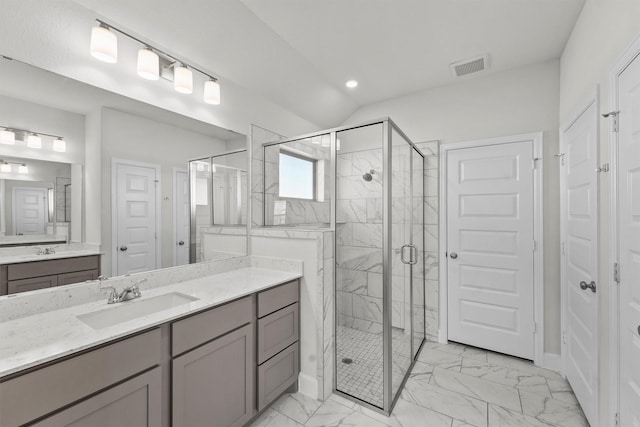 bathroom with vanity and an enclosed shower