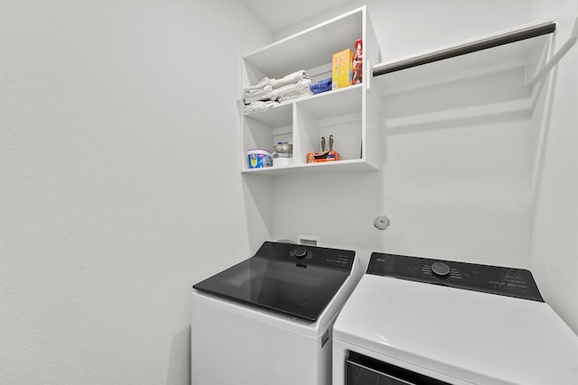 laundry room with independent washer and dryer