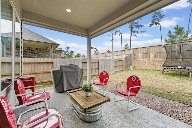 view of patio / terrace with a trampoline and grilling area