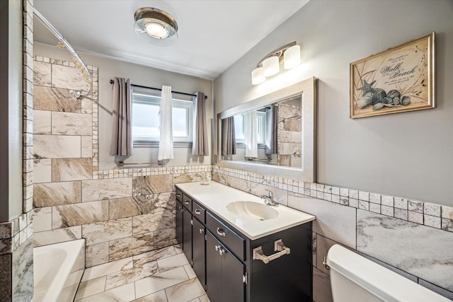 full bathroom featuring vanity, toilet, tile walls, and shower / tub combination