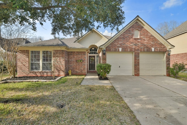 view of front of property featuring a garage and a front lawn