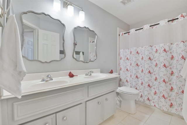 bathroom with a shower with curtain, tile patterned floors, toilet, and vanity