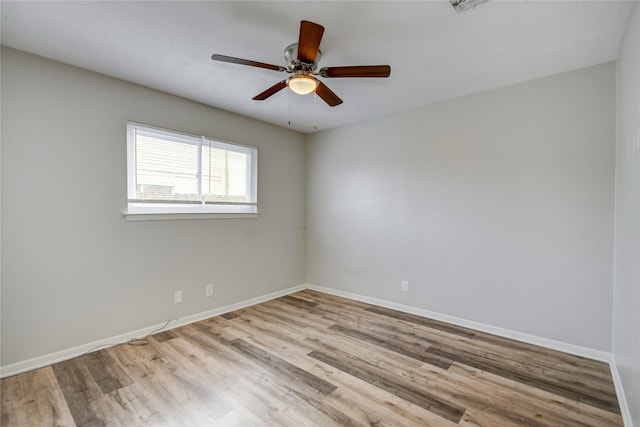 spare room featuring ceiling fan and light hardwood / wood-style flooring