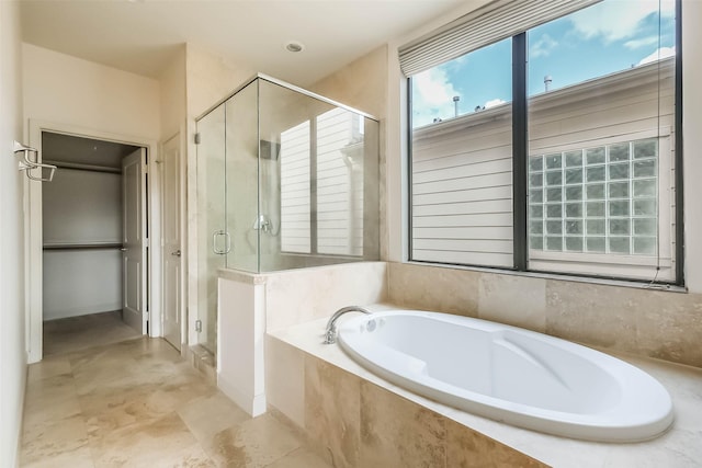 bathroom featuring plus walk in shower