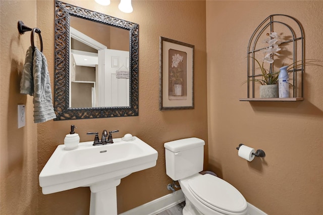 bathroom with sink and toilet