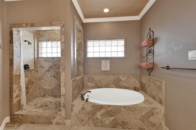 bathroom with ornamental molding, independent shower and bath, and a textured ceiling