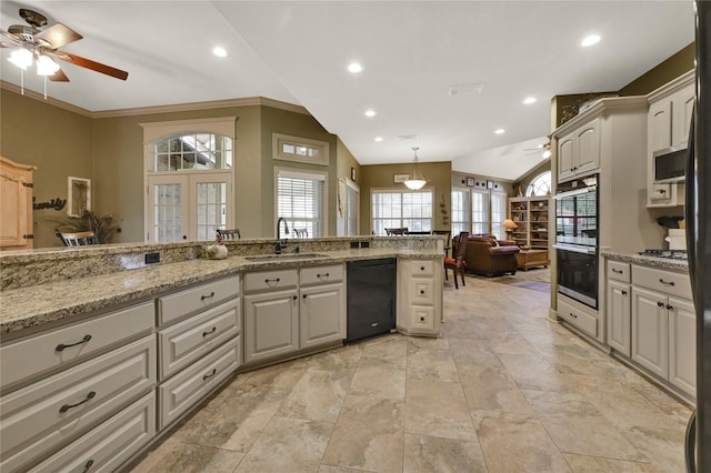 kitchen featuring sink, black dishwasher, light stone countertops, vaulted ceiling, and french doors