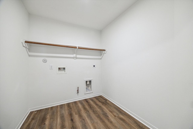 laundry area featuring dark wood-type flooring, washer hookup, hookup for an electric dryer, and hookup for a gas dryer