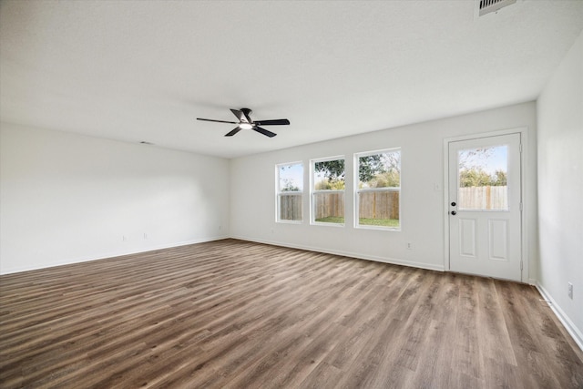 unfurnished living room with hardwood / wood-style flooring and ceiling fan