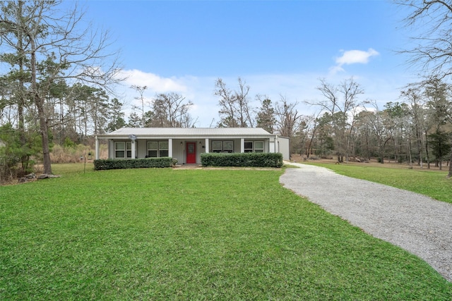 ranch-style home featuring a front yard