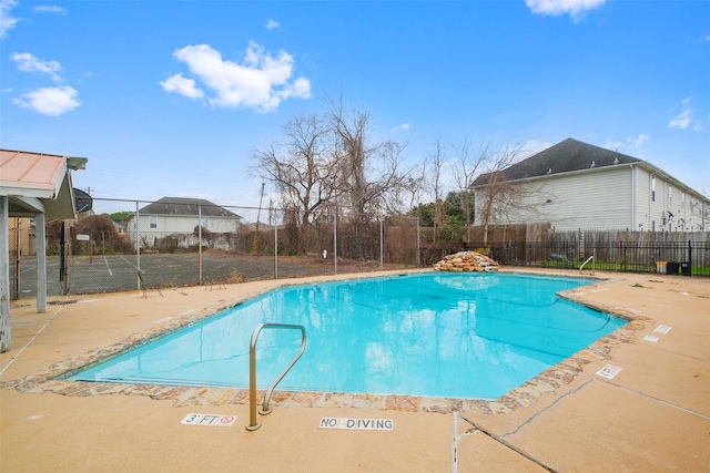 view of swimming pool with a patio