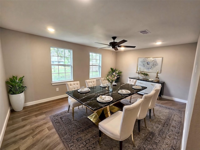 dining area with dark hardwood / wood-style flooring and ceiling fan