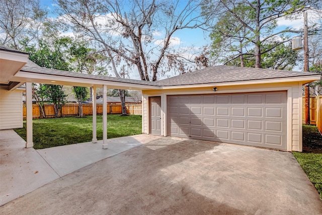 garage featuring a lawn