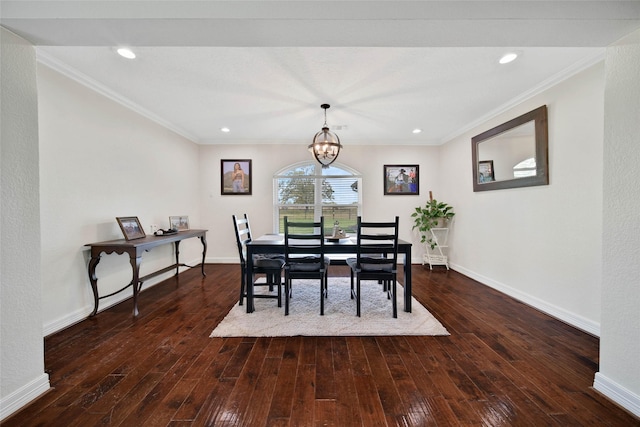 dining room with crown molding, dark hardwood / wood-style floors, and a notable chandelier