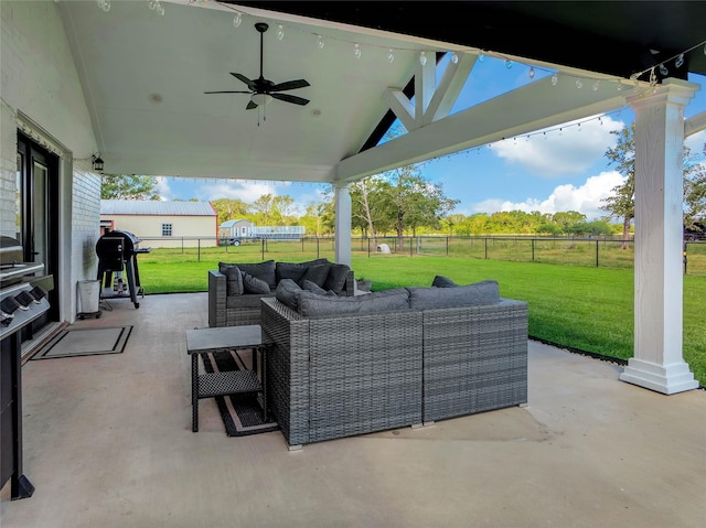 view of patio with area for grilling, outdoor lounge area, and ceiling fan