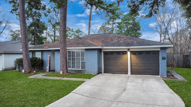 single story home with a garage and a front yard