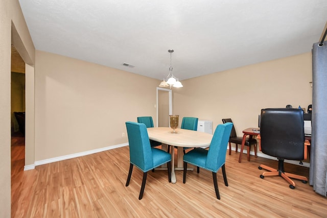 dining space with light wood-type flooring